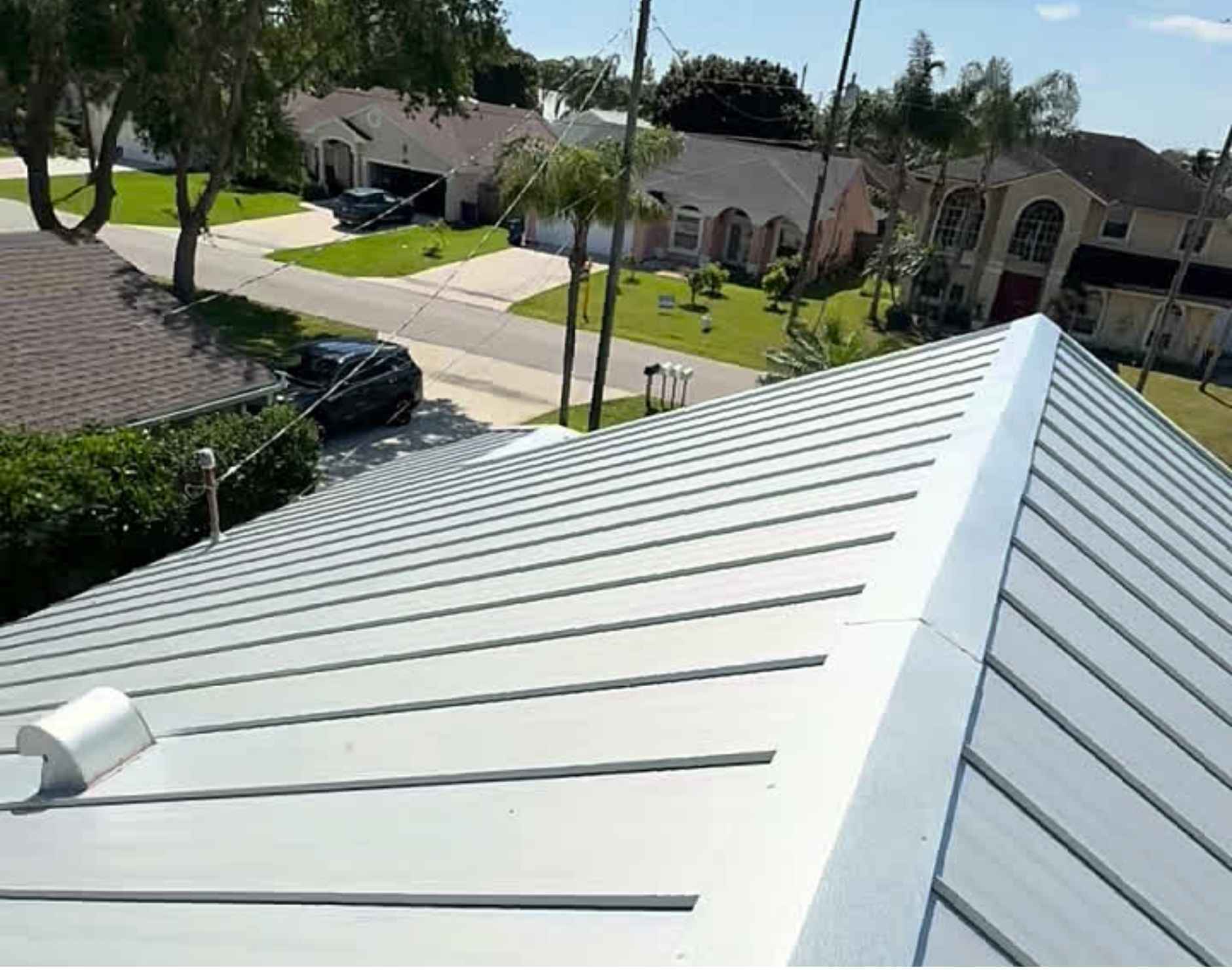 Metal roofs offer superior durability, lighter weight, and 40–70+ year lifespans, making them ideal for high-wind areas. Tile roofs provide exceptional fire resistance, energy efficiency, and a classic aesthetic with 50+ year lifespans, but are heavy and require stronger structural support.